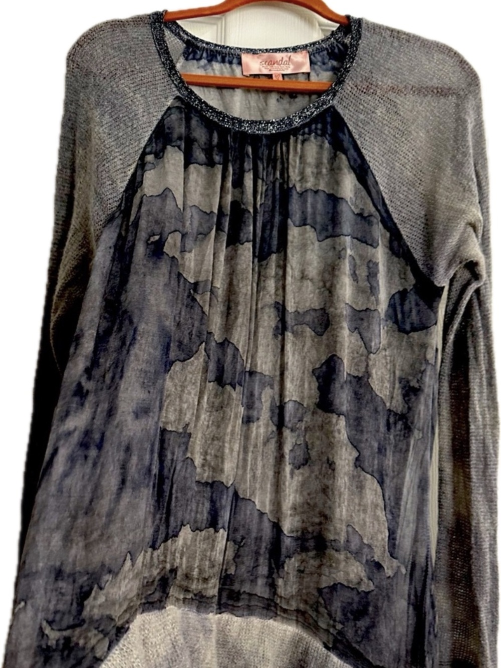 long sleeve casual or dressy top . variations of grey.
